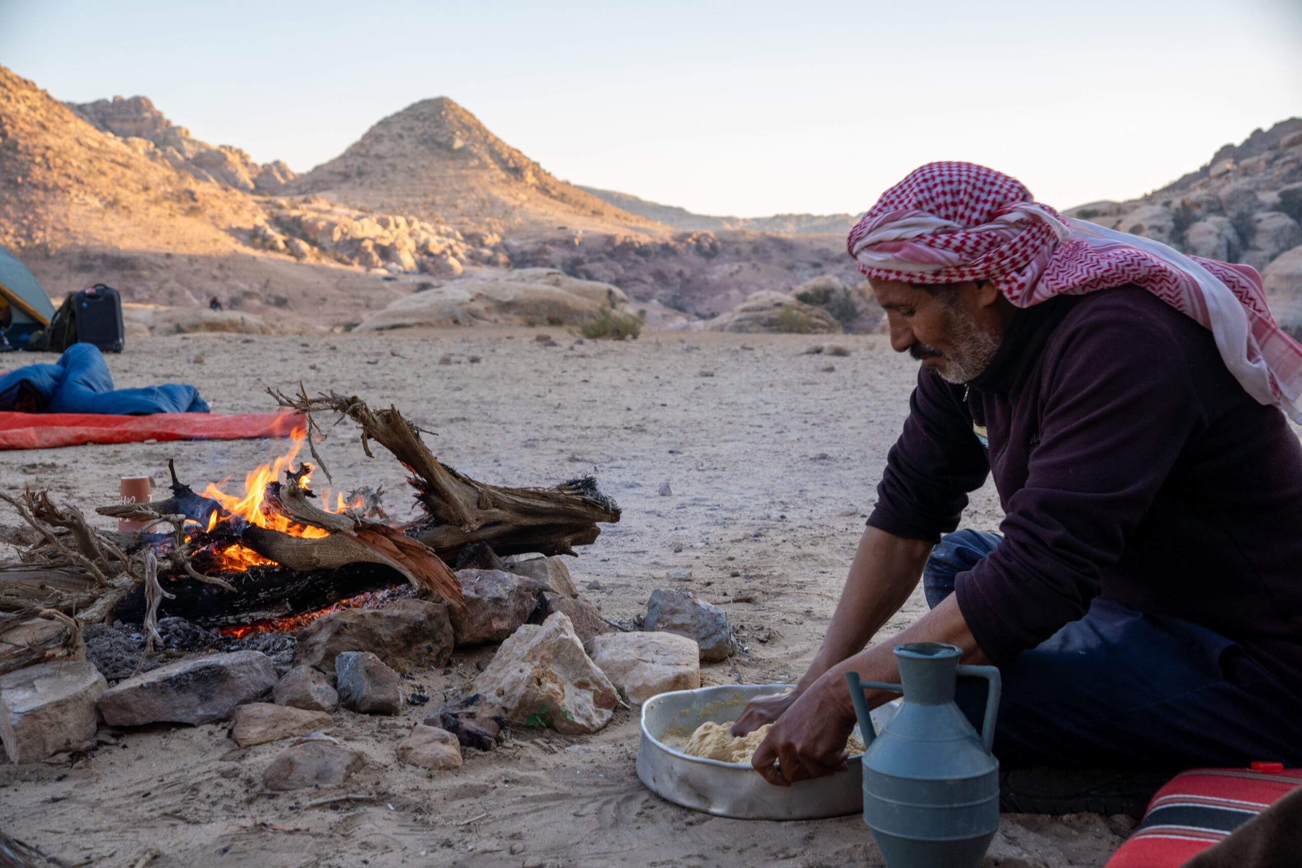 Eid making bread by the fire